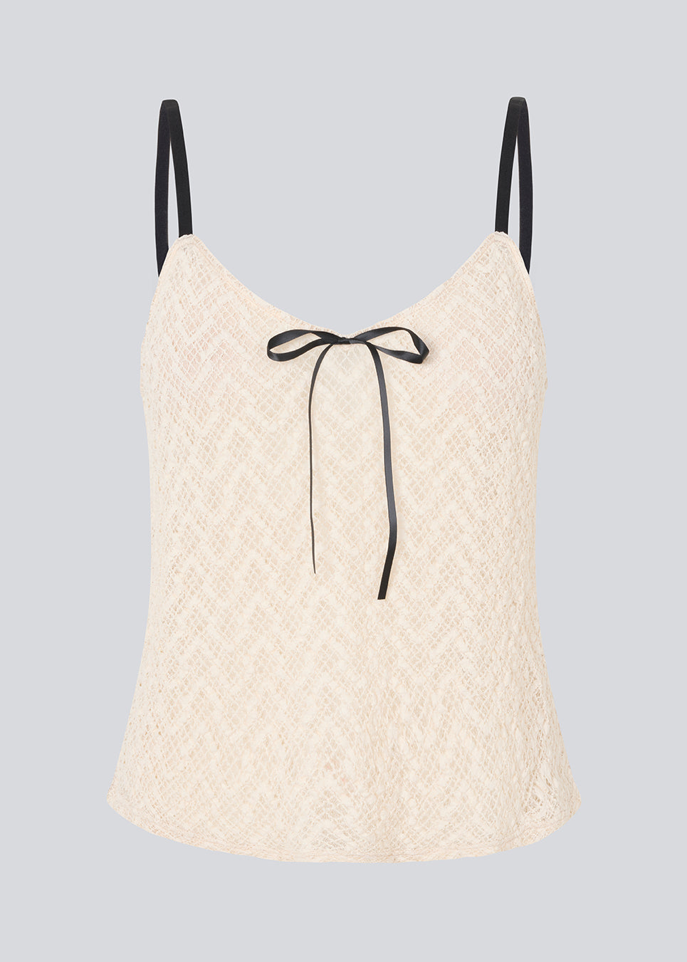 Cute Loose top is in light beige/white soft lace material. EmiliaMD lace top has small adjustable black straps and a black bow detail in front.