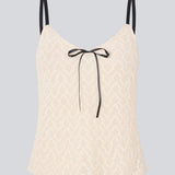 Cute Loose top is in light beige/white soft lace material. EmiliaMD lace top has small adjustable black straps and a black bow detail in front.