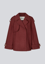 Cropped double-breasted wool coat in burgundy/dark red with hidden buttons. EsmundMD jacket has classic coat details with raglan sleeves and a high yoke at the back. Lined.&nbsp;