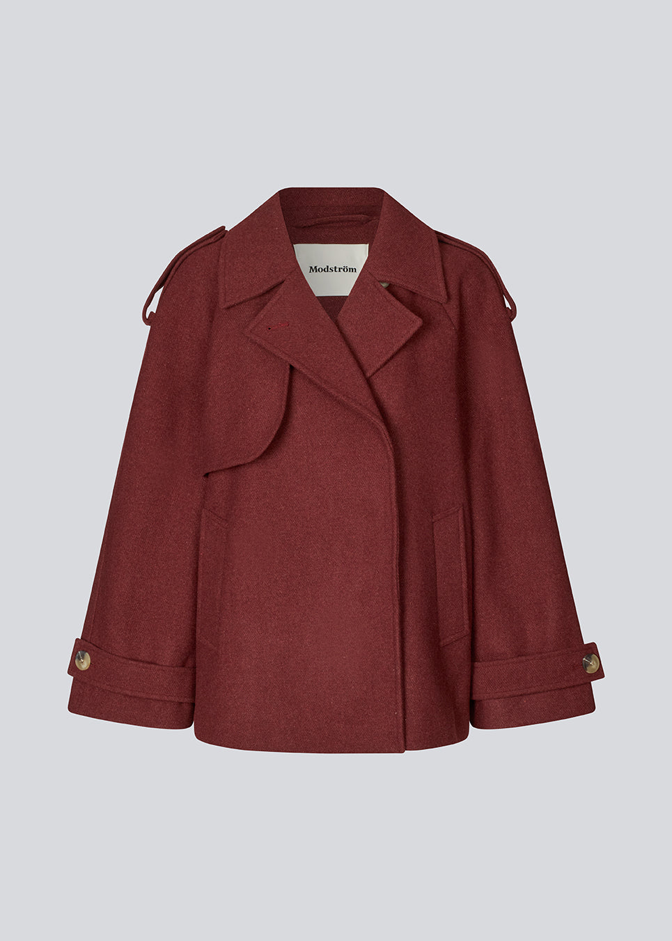 Cropped double-breasted wool coat in burgundy/dark red with hidden buttons. EsmundMD jacket has classic coat details with raglan sleeves and a high yoke at the back. Lined.&nbsp;