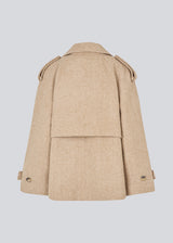 Double-breasted wool coat in a beige corlor with hidden buttons. EsmundMD jacket has classic coat details with raglan sleeves and a high yoke at the back.