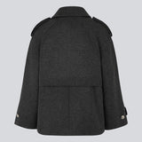 Double-breasted black wool coat with hidden buttons. EsmundMD jacket has classic coat details with raglan sleeves and a high yoke at the back.