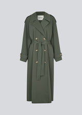 Oversized double-breasted trench coat in dark green with a tie belt at the waist. EvieMD jacket has dropped shoulders and long, wide sleeves. Lined.&nbsp;