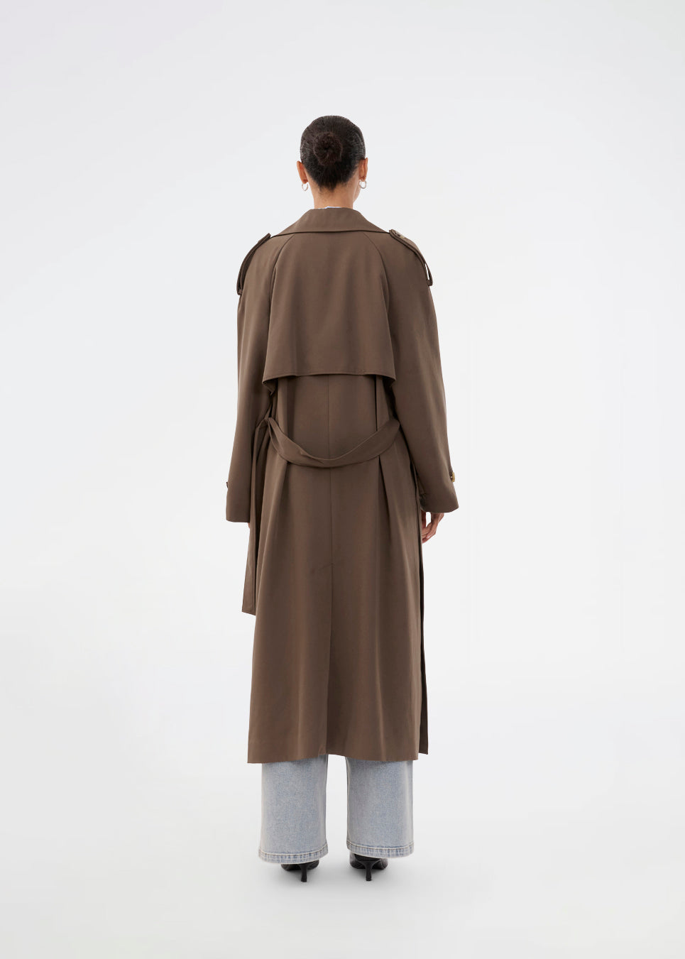 Oversized double-breasted trench coat in dark brown with tie belt at the waist. EvieMD jacket has dropped shoulders and long, wide sleeves. Lined.&nbsp;