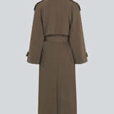 Oversized double-breasted trench coat in dark brown with tie belt at the waist. EvieMD jacket has dropped shoulders and long, wide sleeves. Lined. '