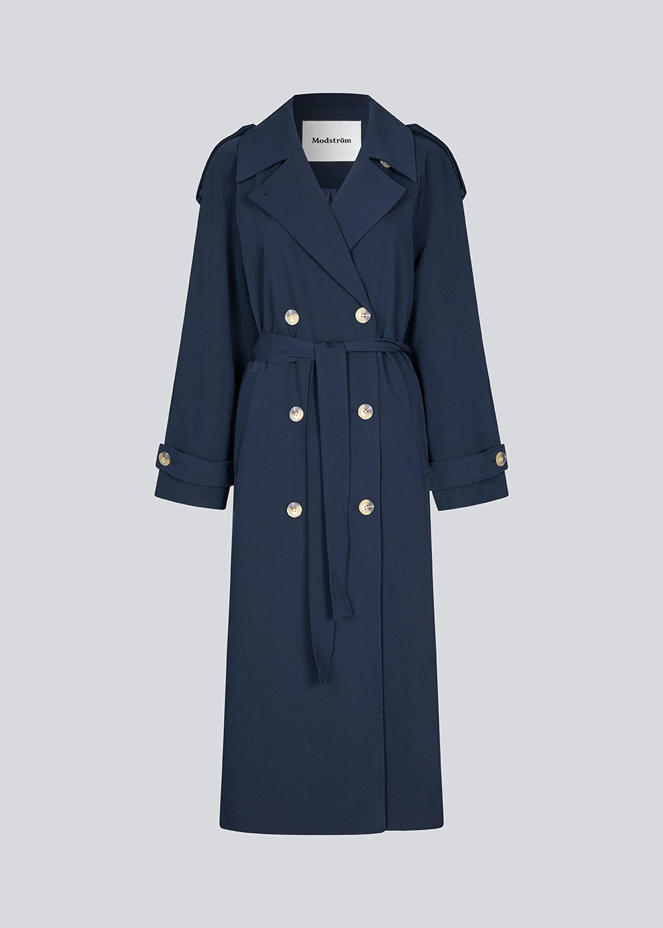 Oversized double-breasted trench coat with tie belt at the waist. EvieMD jacket has dropped shoulders and long, wide sleeves. Lined. The model is 175 cm and wears a size S/36.