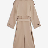 Oversized double-breasted trench coat in light beige with tie belt at the waist. EvieMD jacket has dropped shoulders and long, wide sleeves. Lined. The model is 175 cm and wears a size S/36.