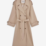 Oversized double-breasted trench coat in light beige with tie belt at the waist. EvieMD jacket has dropped shoulders and long, wide sleeves. Lined. The model is 175 cm and wears a size S/36.