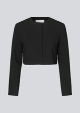 Cropped blazer in a structured material. FaiMD blazer is collarless and has fabric-covered buttons in front and long, slim sleeves. Lined. Style with matching skirt: FaiMD skirt.