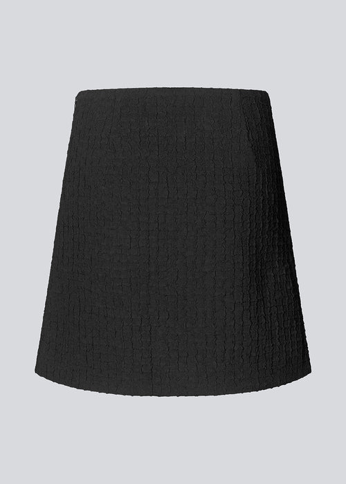 Short A-line dress in a structured material. FaiMD skirt has a high waist with a hidden zipper at the side. Lined. Style with matching blazer: FaiMD blazer.