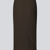 Tight fitted midi skirt in a soft, ribbed material. FainaMD skirt is designed with a high waist with covered elastication, and a high slit in front. Part of matching set. Buy the tube top here. The model is 175 cm and wears a siz