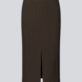 Tight fitted midi skirt in a soft, ribbed material. FainaMD skirt is designed with a high waist with covered elastication, and a high slit in front. Part of matching set. Buy the tube top here. The model is 175 cm and wears a siz