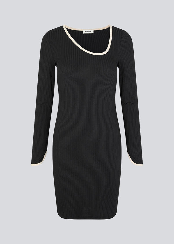 Midi dress in rib knit with a figure-hugging silhouette. FaizMD short dress has an asymmetrical neckline, long sleeves with slit at cuff, along with a slit at each side. 