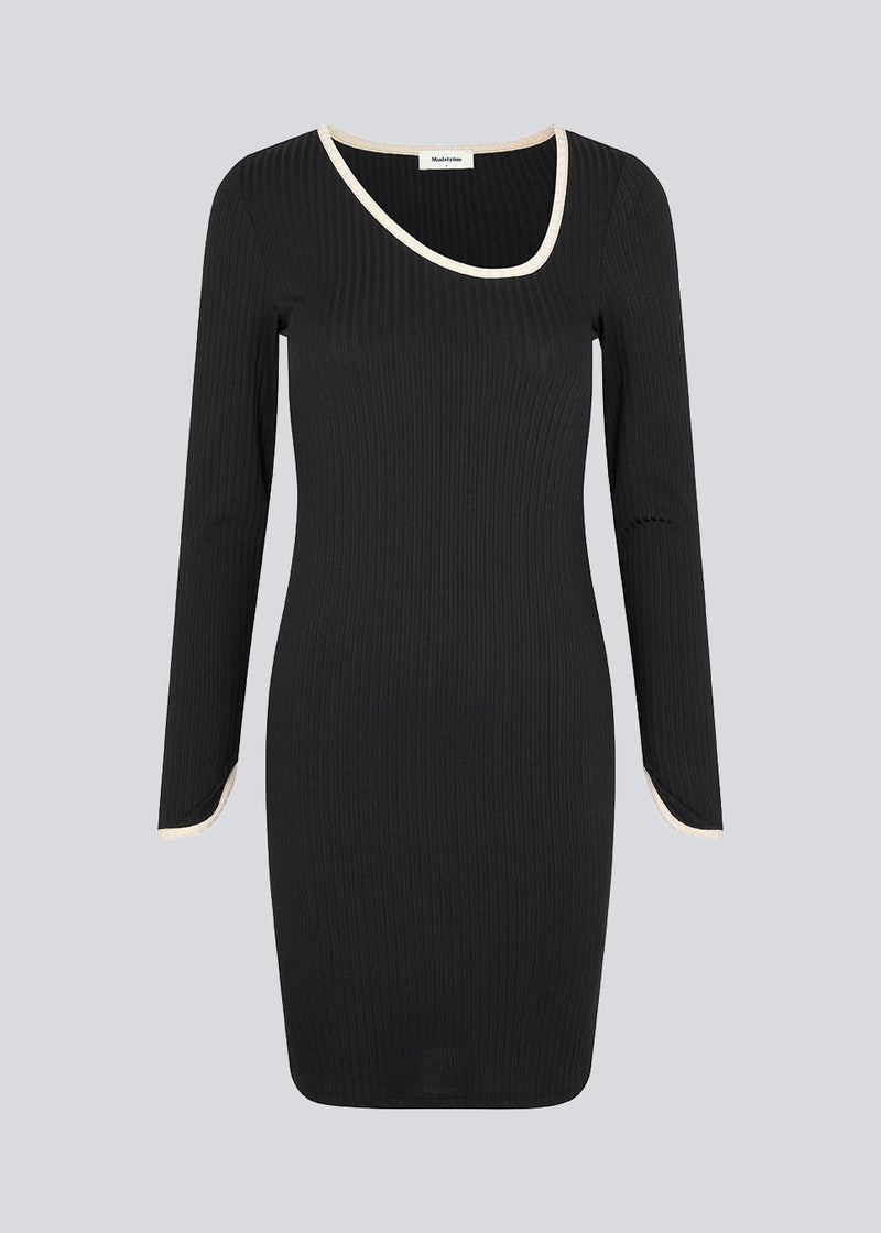 Midi dress in rib knit with a figure-hugging silhouette. FaizMD short dress has an asymmetrical neckline, long sleeves with slit at cuff, along with a slit at each side. 