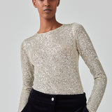 Long sleeved top fully decorated with sequins. FannieMD top has a tight fit with a round neck and long sleeves. The model is 175 cm and wears a size S/36.