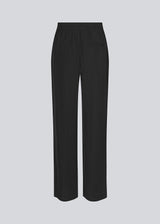 FanyaMD pants in black have a menswear-inspired look with straight, wide legs, a high waist with zip fly and button and elastication in back. Doubble pleat in front and side pockets. 