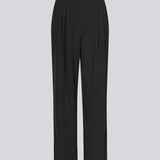 FanyaMD pants in black have a menswear-inspired look with straight, wide legs, a high waist with zip fly and button and elastication in back. Doubble pleat in front and side pockets. 