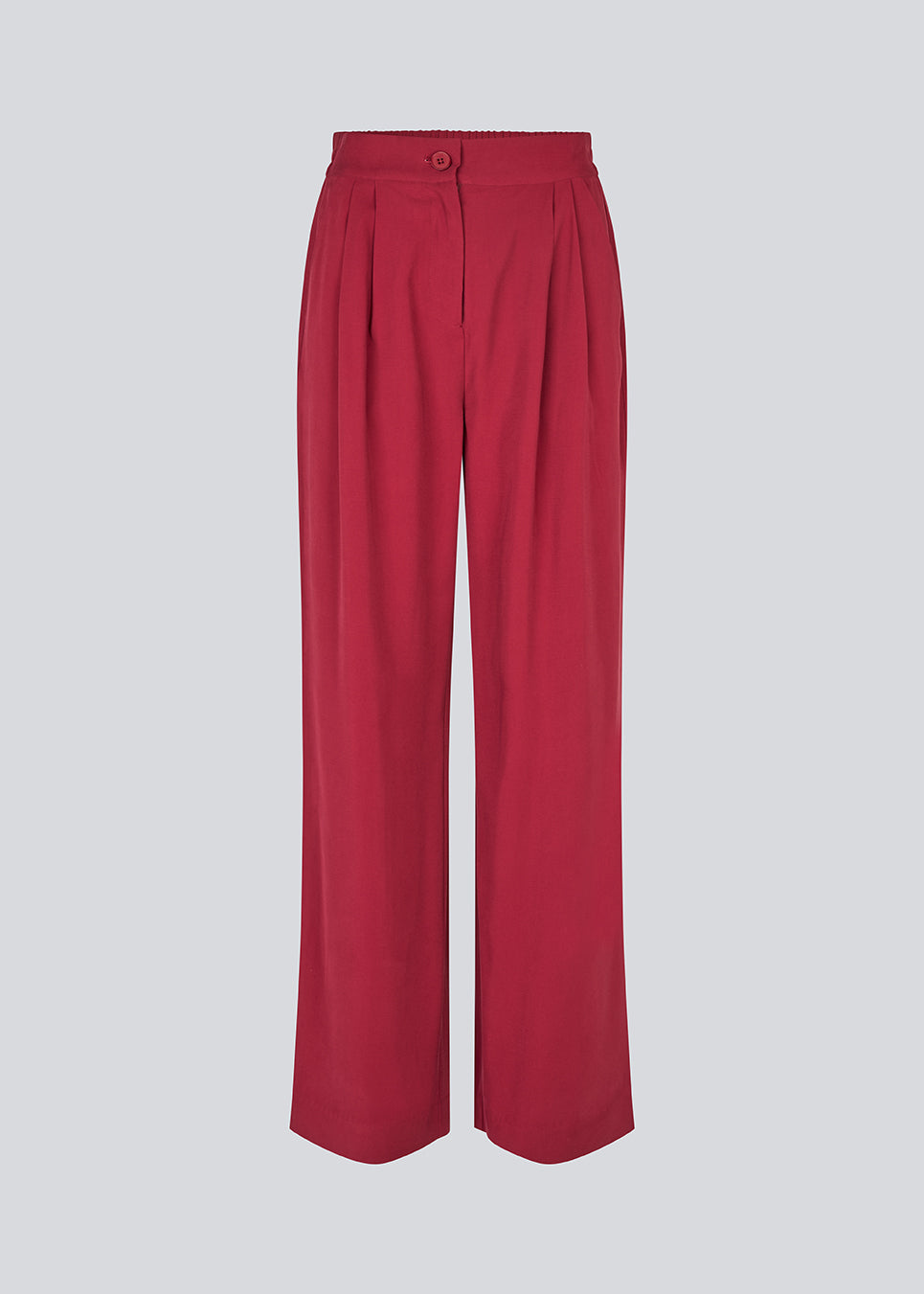 FanyaMD pants have a menswear-inspired look with straight, wide legs, a high waist with zip fly and button and elastication in back. Doubble pleat in front and side pockets. The model is 175 cm and wears a size S/36.