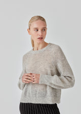 Jumper in a soft and fluffy mohair quality. FathiaMD o-neck has a relaxed shape with round neckline, wide raglan sleeves and ribbed trimmings. The model is 175 cm and wears a size S/36.