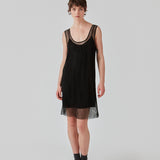 Short dress with a straight silhouette and wide straps. FazilMD dress has a see-through overlay with shiny pearls and a slip dress with a v-neckline. The model is 175 cm and wears a size S/36.