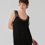 Short dress with a straight silhouette and wide straps. FazilMD dress has a see-through overlay with shiny pearls and a slip dress with a v-neckline. The model is 175 cm and wears a size S/36.