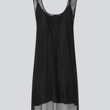 Short dress with a straight silhouette and wide straps. FazilMD dress has a see-through overlay with shiny pearls and a slip dress with a v-neckline. The model is 175 cm and wears a size S/36.