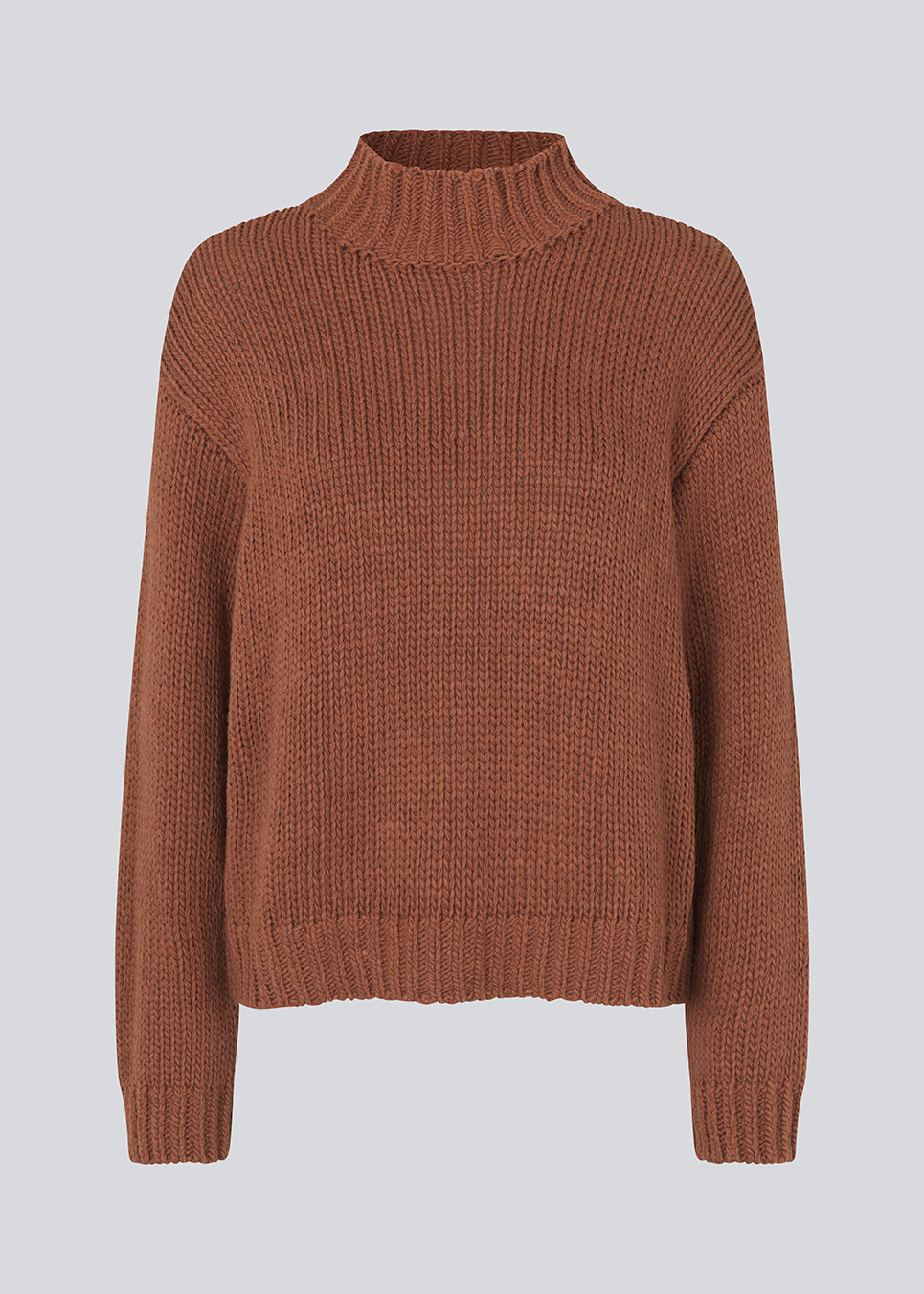 Oversized knit with dropped shoulders and long sleeves. FelipeMD t-neck has a high neck with ribbed trimmings on the neckline and hem of sleeves. The model is 175 cm and wears a size S/36.