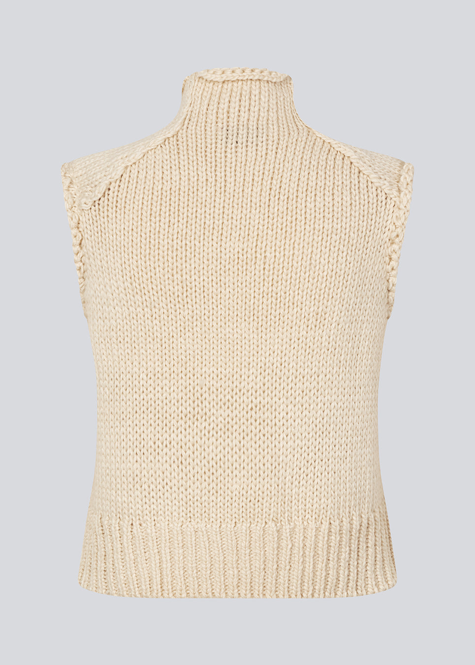 Loose off white sleeveless vest in plain jersey knit. FelipeMD vest is slightly cropped and has a high neck.