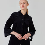 Midi shirt dress in navy sky in corduroy with collar and press-studs in front. FikaMD dress has a loose A-line silhouette and 3/4 length wide sleeves. The model is 175 cm and wears a size S/36.