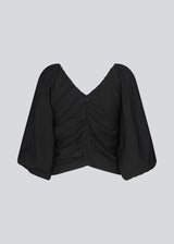 Long sleeved top in black in woven quality with long, voluminous sleeves. FisherMD top has a v-neckline in front and back with ruched seams, adding a drapy effect.