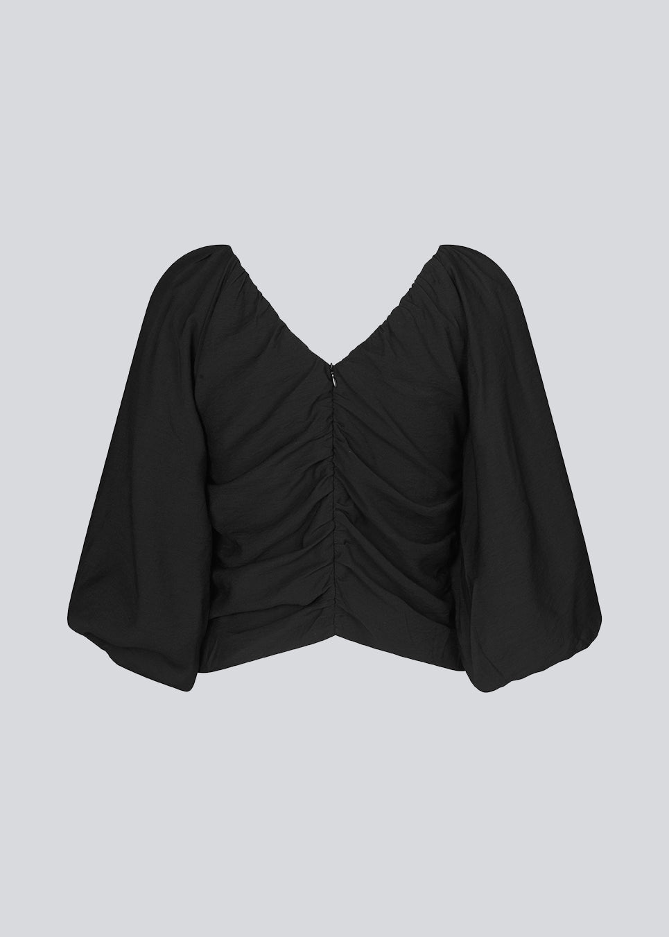 Long sleeved top in black in woven quality with long, voluminous sleeves. FisherMD top has a v-neckline in front and back with ruched seams, adding a drapy effect.