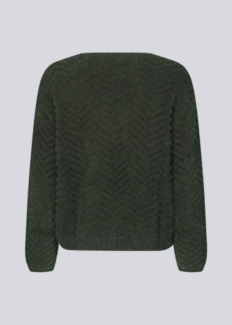 Fluffy knitted jumper with a loose fit in patterned cotton mix. FloriaMD v-neck has a v-neckline, long sleeves and ribbed trimmings. The model is 175 cm and wears a size S/36.