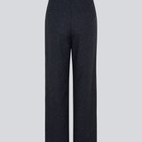 Long-tailored pants with wide legs and pleats in front. FolaMD pants are designed in a wool blend with tiny colored flecks. Part of a set, buy the matching blazer here: FolaMD blazer. The model is 175 cm and wears a size S/36.