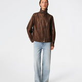 Forestmd jacket is designed in a relaxed silhouette with a high stand collar, concealed asymmetrical closure, and elasticated hem for a cool bomber-inspired look. The textured leather-look finish adds character, while the oversized fit makes it a versatile outerwear piece that effortlessly elevates both casual and dressed-up outfits.
