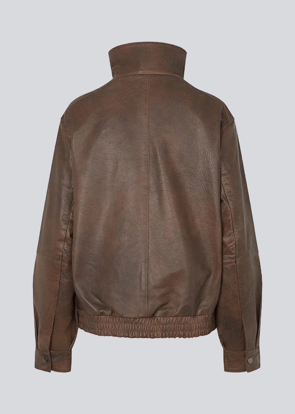 Forestmd jacket is designed in a relaxed silhouette with a high stand collar, concealed asymmetrical closure, and elasticated hem for a cool bomber-inspired look. The textured leather-look finish adds character, while the oversized fit makes it a versatile outerwear piece that effortlessly elevates both casual and dressed-up outfits.
