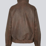 Forestmd jacket is designed in a relaxed silhouette with a high stand collar, concealed asymmetrical closure, and elasticated hem for a cool bomber-inspired look. The textured leather-look finish adds character, while the oversized fit makes it a versatile outerwear piece that effortlessly elevates both casual and dressed-up outfits.
