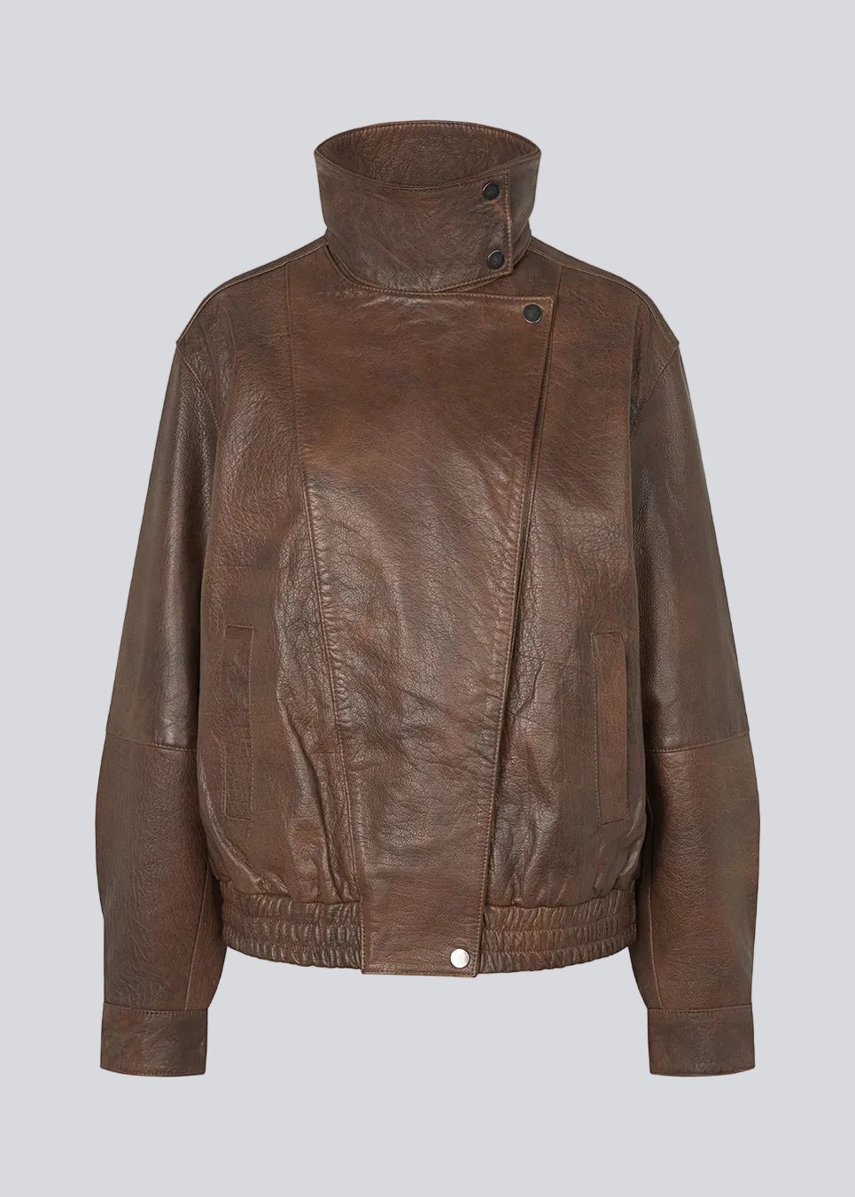Forestmd jacket is designed in a relaxed silhouette with a high stand collar, concealed asymmetrical closure, and elasticated hem for a cool bomber-inspired look. The textured leather-look finish adds character, while the oversized fit makes it a versatile outerwear piece that effortlessly elevates both casual and dressed-up outfits.
