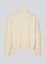 Off white rib knitted jumper with a high neck and a relaxed fit. FultonMD rib t-neck has dropped shoulders and long wide sleeves.