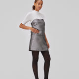 GabbieMD skirt cut for a mini silhuet with a high waist and concealed zipper in a structured and shiny material. Lined. The model is 175 cm and wears a size S/36.