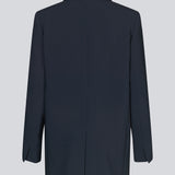Gale blazer in midnight blue has a classic and elegant design, fulfilled by the beautiful revers collar and a long fit. The blazer has button closure at the front and a chest pocket at the left side.   Style the blazer with matching pants in the same co