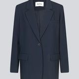 Gale blazer in midnight blue has a classic and elegant design, fulfilled by the beautiful revers collar and a long fit. The blazer has button closure at the front and a chest pocket at the left side.   Style the blazer with matching pants in the same co