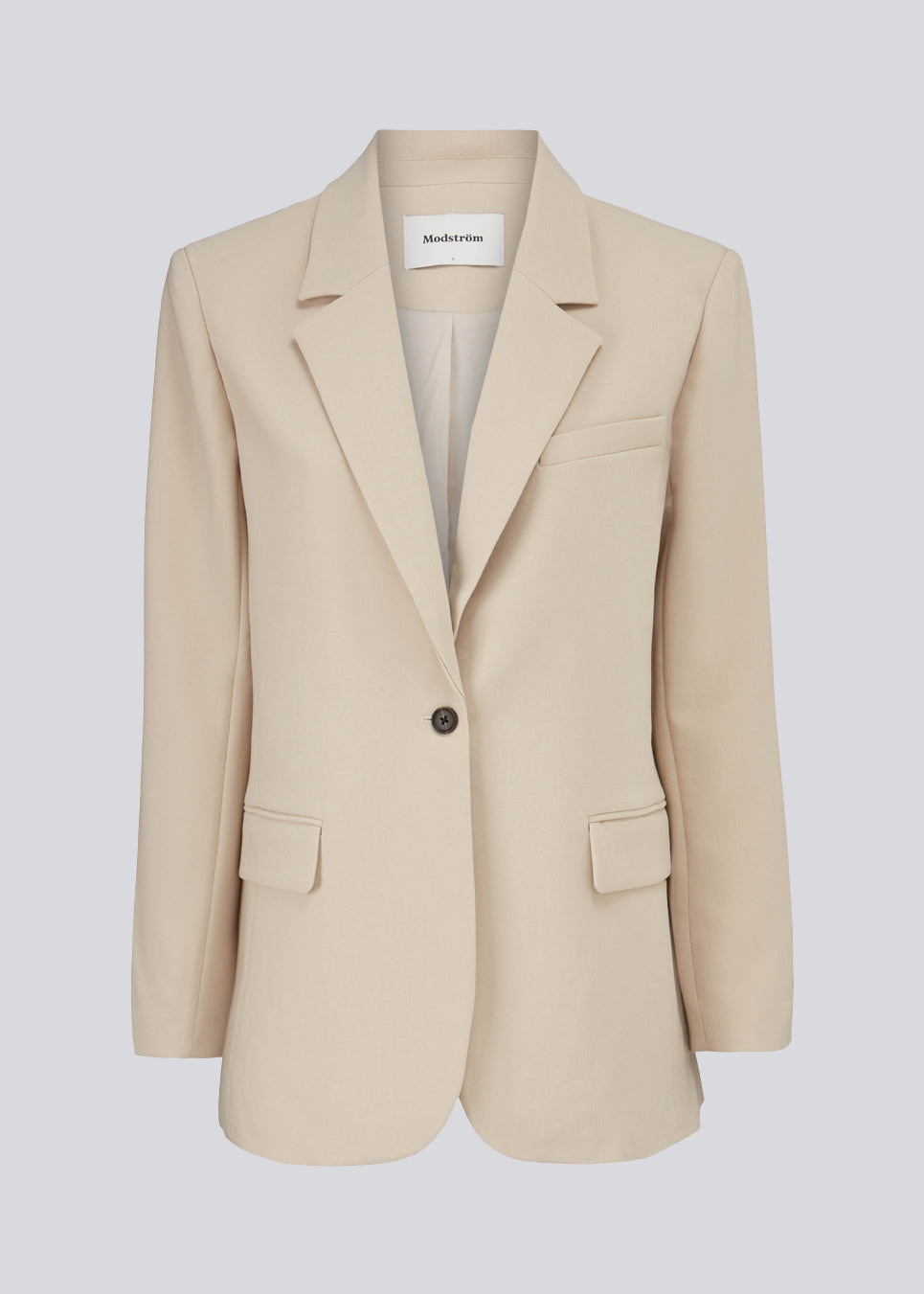 Gale blazer in Powder Sand has a classic and elegant design, fulfilled by the beautiful revers collar and a long fit. The blazer has button closure at the front and a chest pocket at the left side.