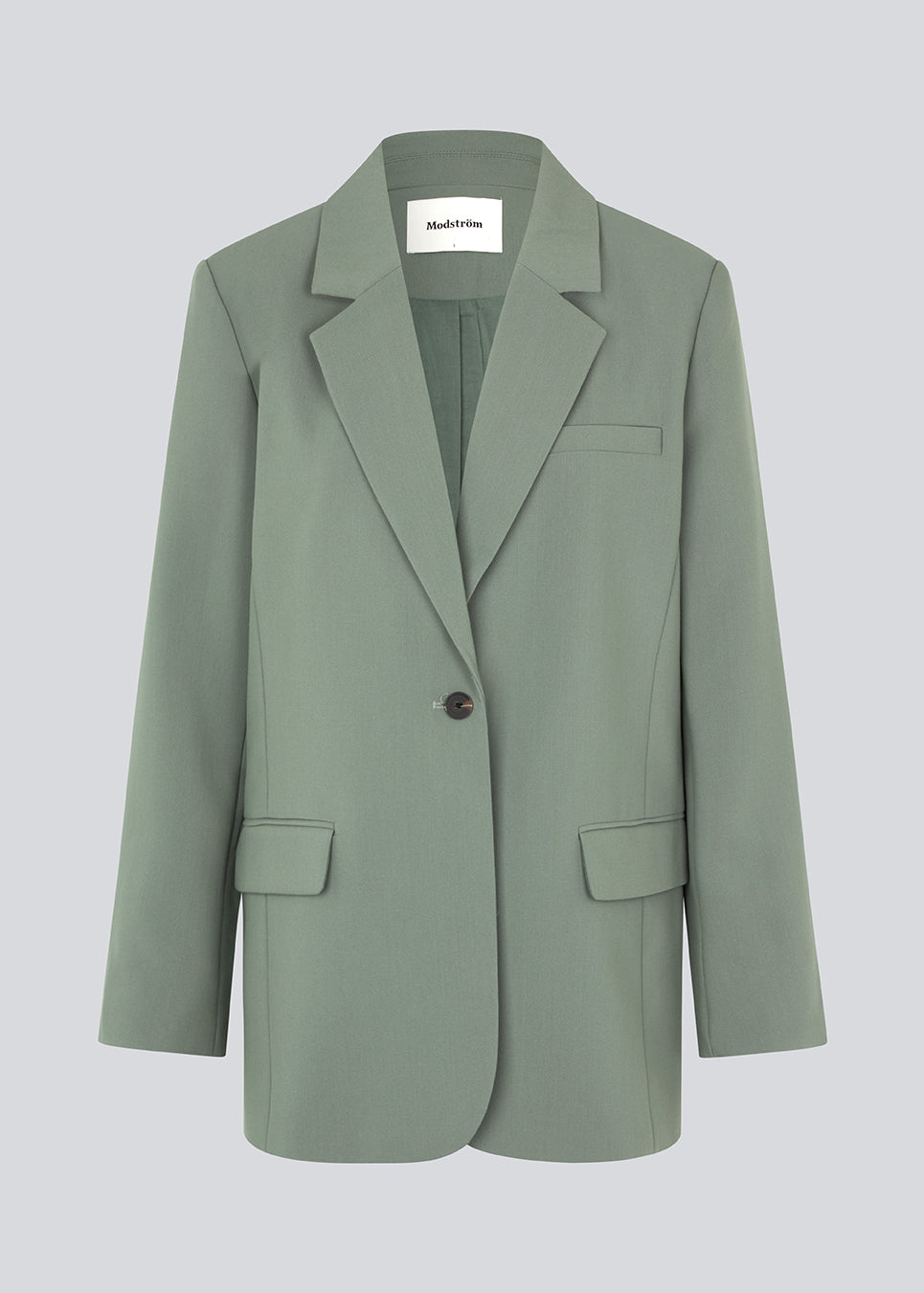 Gale blazer in soft green has a classic and elegant design, fulfilled by the beautiful revers collar and a long fit. The blazer has button closure at the front and a chest pocket at the left side. The model is 175 cm and wears a size S/36.