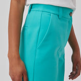 Gale pants in turquoise have a classic design. The pants have straight, wide legs with press folds, which creates an elegant look. The model is 175 cm and wears a size S/36.  Shop matching blazer: Gale blazer.