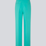 Gale pants in turquoise have a classic design. The pants have straight, wide legs with press folds, which creates an elegant look. The model is 175 cm and wears a size S/36.  Shop matching blazer: Gale blazer.
