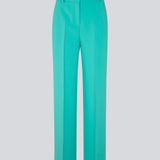 Gale pants in turquoise have a classic design. The pants have straight, wide legs with press folds, which creates an elegant look. The model is 175 cm and wears a size S/36.  Shop matching blazer: Gale blazer.