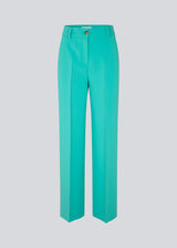Gale pants in turquoise have a classic design. The pants have straight, wide legs with press folds, which creates an elegant look. The model is 175 cm and wears a size S/36.  Shop matching blazer: Gale blazer.