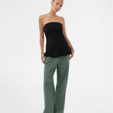 Gale pants in dark green have a classic design. The pants have straight, wide legs with pressfolds, which create an elegant look. The model is 175 cm and wears a size S/36.