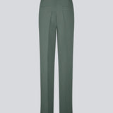Gale pants in dark green have a classic design. The pants have straight, wide legs with pressfolds, which create an elegant look. The model is 175 cm and wears a size S/36.