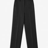 Gale pants in Black have a classic design. The pants have straight, wide legs with pressfolds, which creates an elegant look.